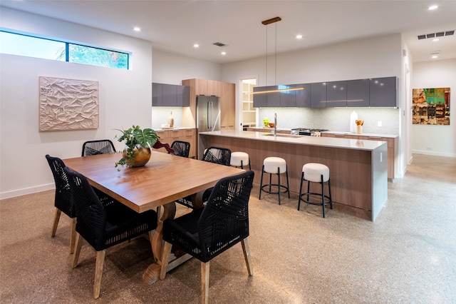 dining room featuring sink