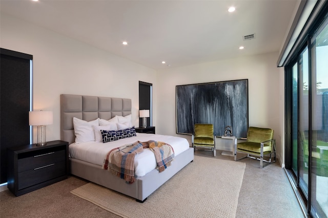 bedroom featuring access to outside and light colored carpet