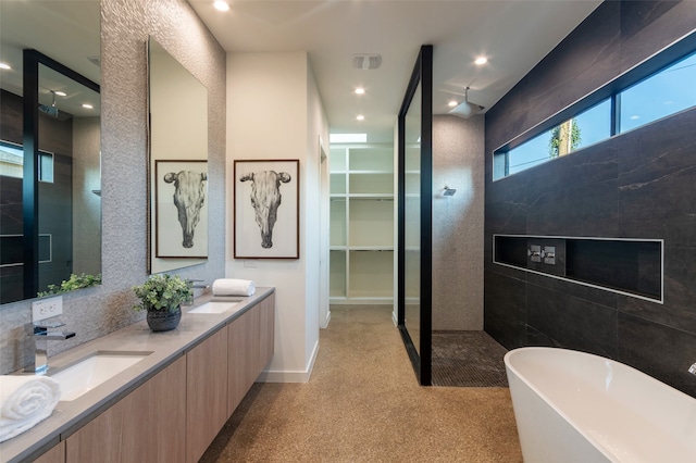 bathroom with independent shower and bath and vanity