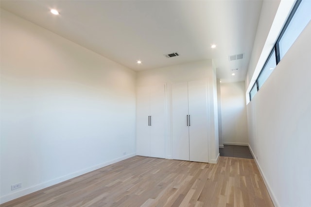 unfurnished room featuring light hardwood / wood-style floors