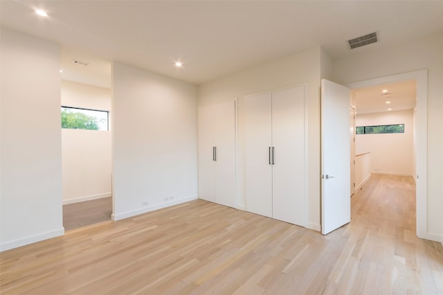 unfurnished bedroom featuring light hardwood / wood-style flooring