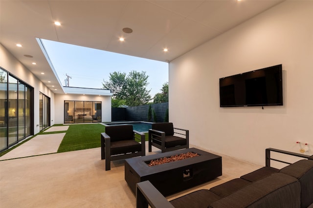 view of patio featuring an outdoor living space with a fire pit