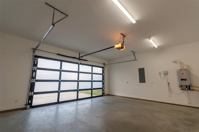 garage featuring water heater, a garage door opener, and electric panel