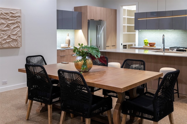 dining area featuring sink