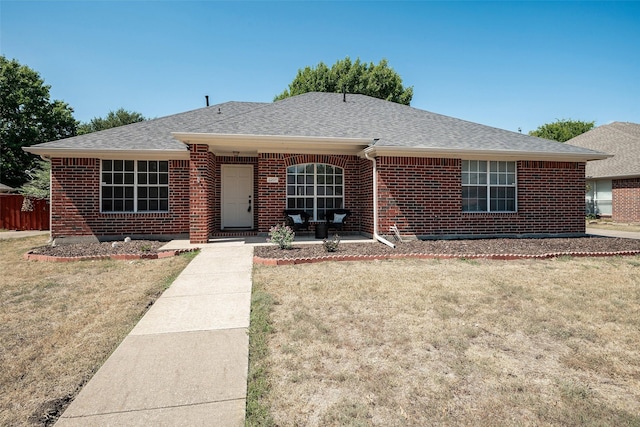 ranch-style home with a front yard