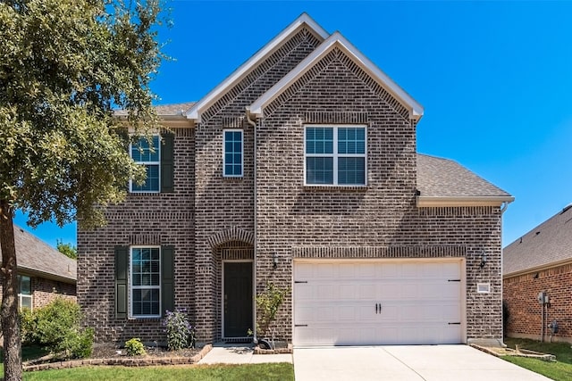 front of property with a garage