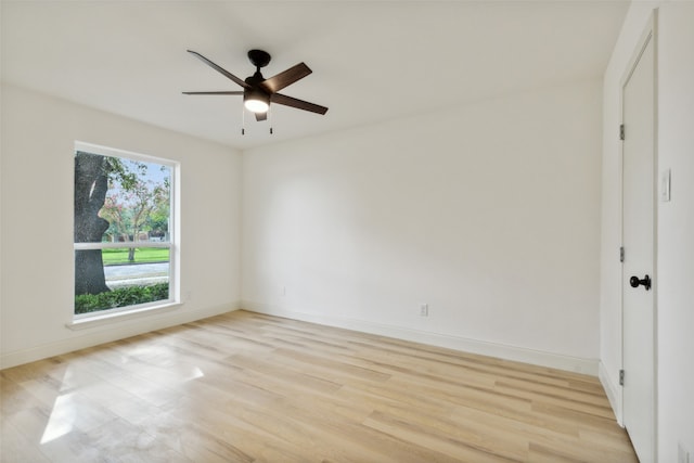 empty room featuring ceiling fan and light wood-type flooring