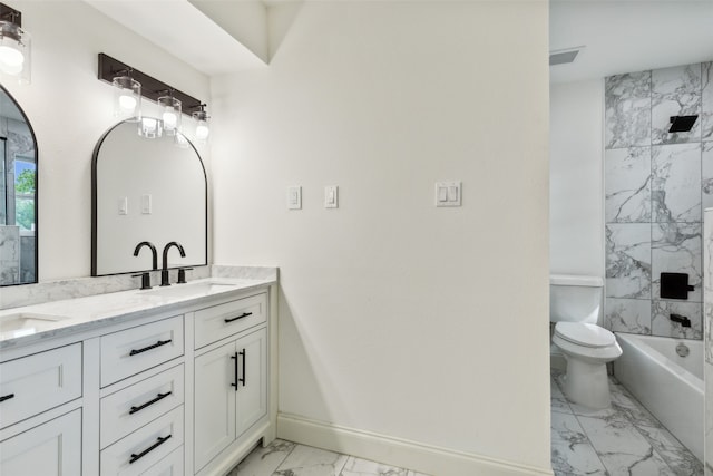 full bathroom with tiled shower / bath combo, vanity, and toilet