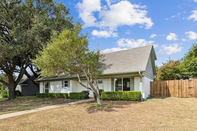 view of front of home with a front lawn