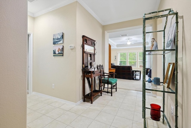 corridor featuring light tile patterned flooring and ornamental molding