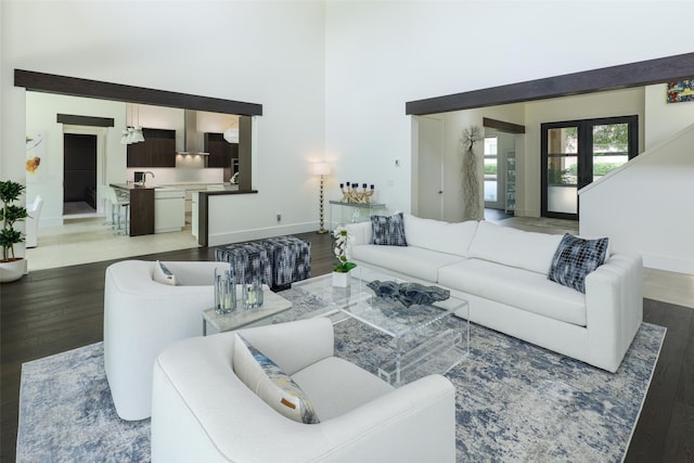 living room with french doors, hardwood / wood-style flooring, and sink