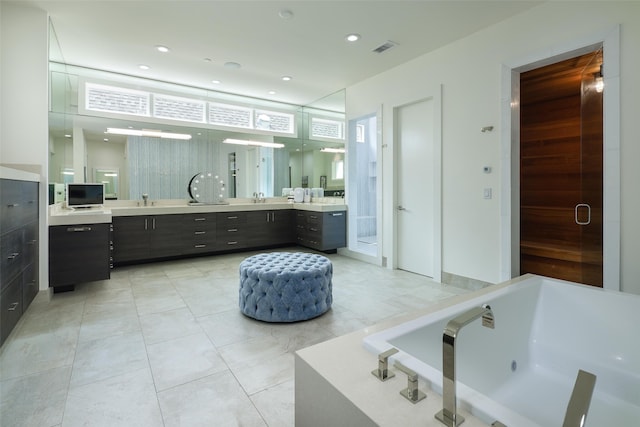 bathroom with vanity, tile patterned floors, and independent shower and bath