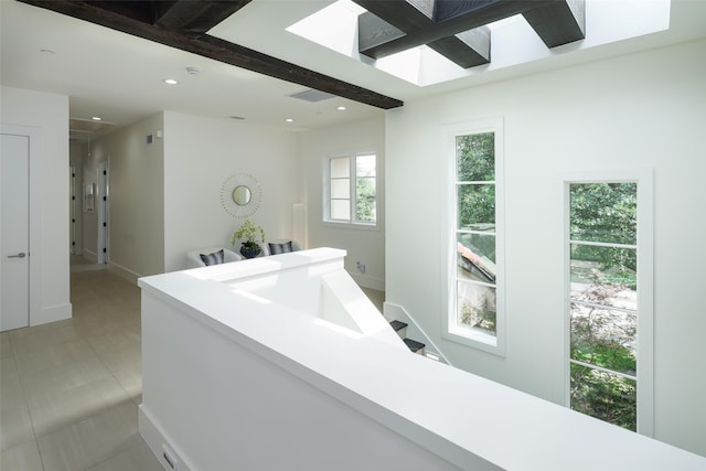 bathroom featuring beamed ceiling