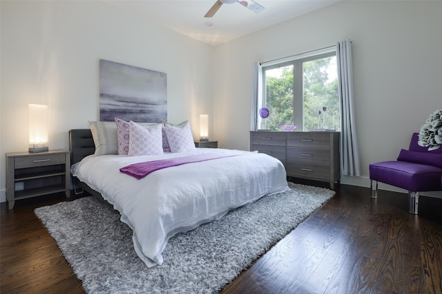 bedroom featuring ceiling fan and dark wood-type flooring