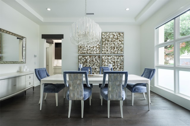 dining room featuring dark wood-type flooring and an inviting chandelier