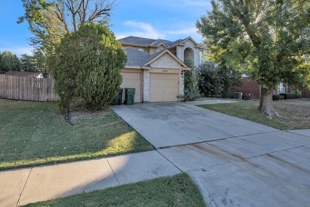 view of front facade with a front lawn and a garage