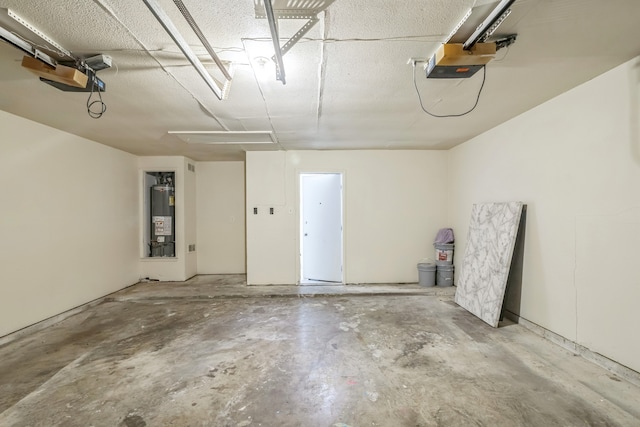 garage featuring a garage door opener and gas water heater