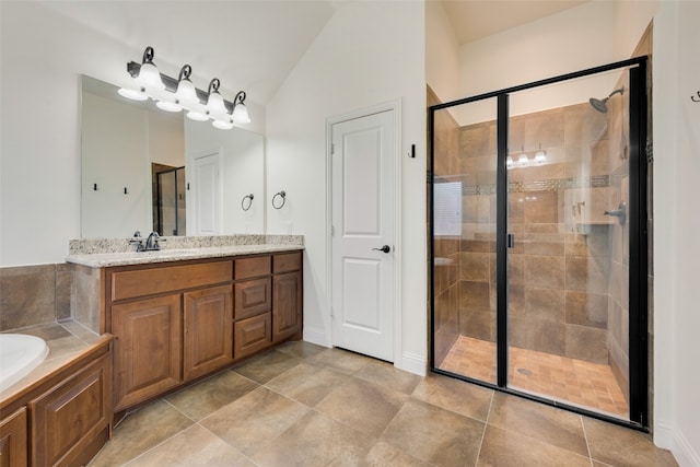 bathroom with vanity, plus walk in shower, tile patterned flooring, and lofted ceiling