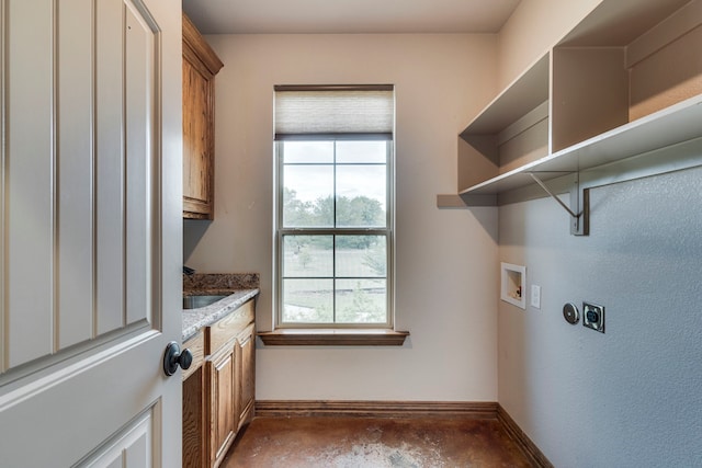 laundry area with washer hookup, cabinets, sink, and hookup for an electric dryer