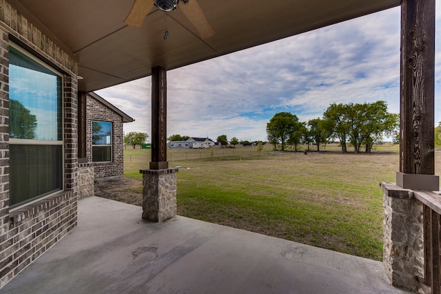 view of patio / terrace featuring ceiling fan