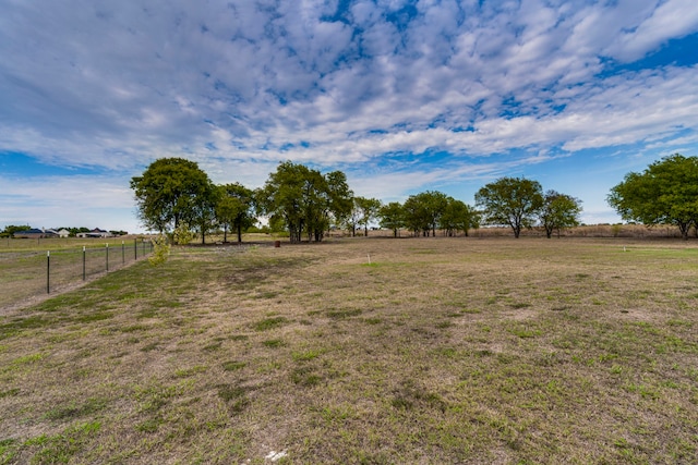 view of yard with a rural view