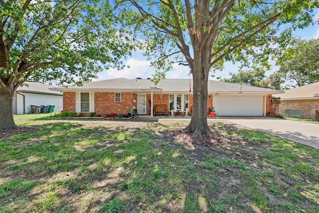 single story home with a garage and a front lawn