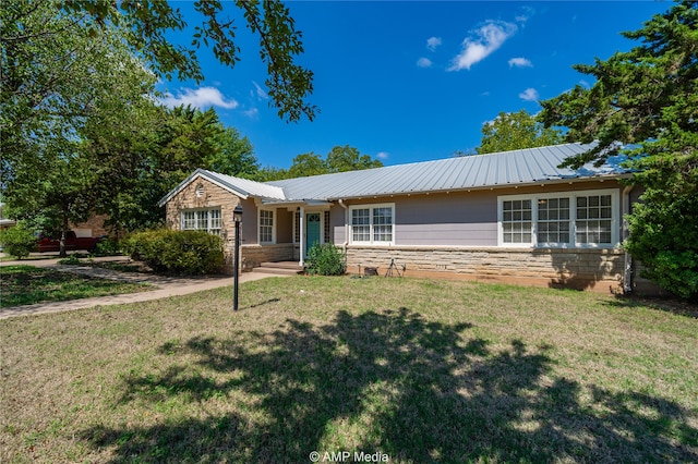 ranch-style home with a front yard