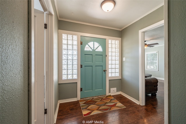 entryway featuring ceiling fan, crown molding, and dark hardwood / wood-style flooring