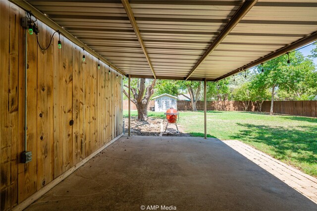 view of patio / terrace featuring a storage shed