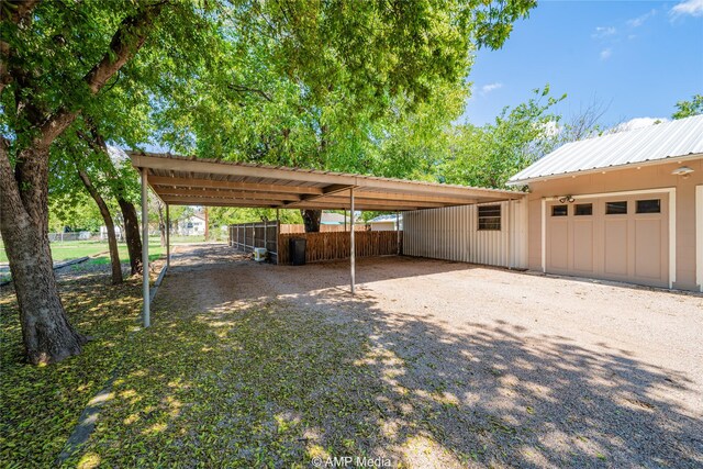 view of parking / parking lot with a carport