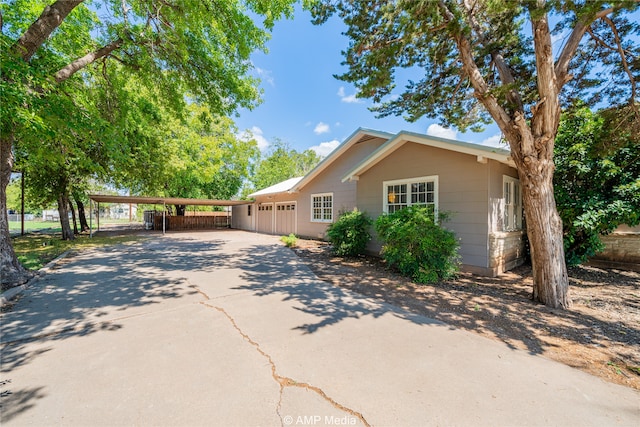 ranch-style house featuring a carport