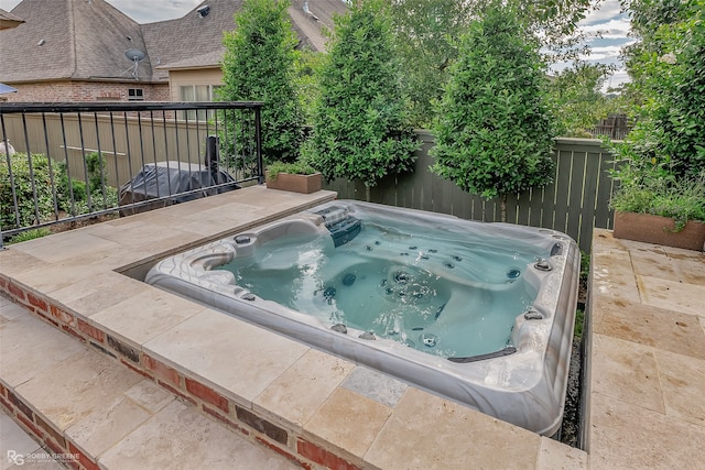 view of pool featuring an outdoor hot tub