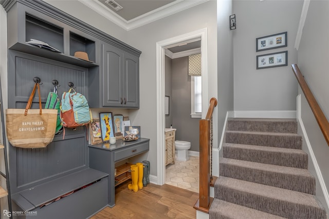 interior space with wood-type flooring and ornamental molding