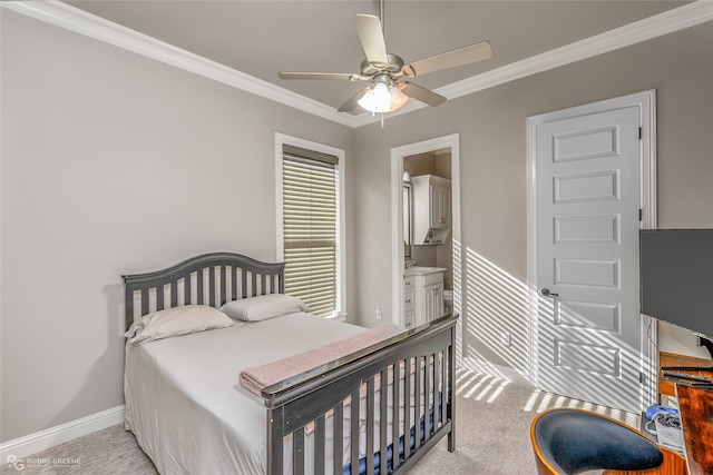 bedroom featuring crown molding, ceiling fan, light carpet, and ensuite bath