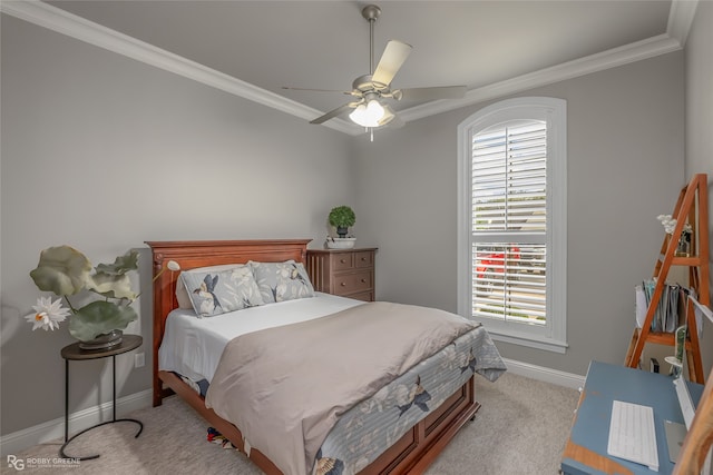 bedroom featuring light carpet, ceiling fan, and crown molding