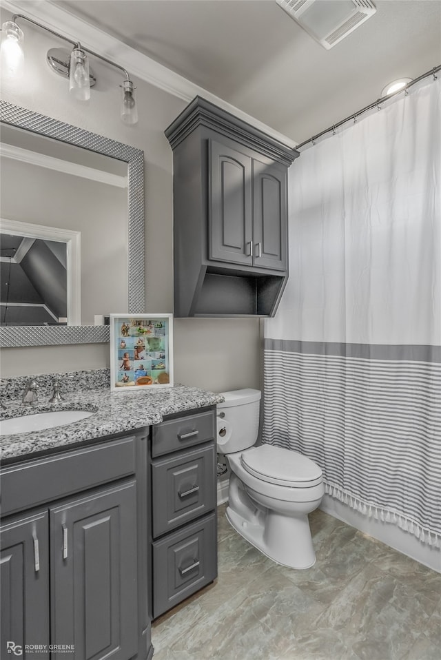 bathroom featuring curtained shower, crown molding, vanity, and toilet