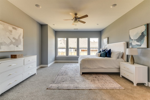 bedroom featuring ceiling fan and light colored carpet