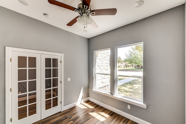 spare room with ceiling fan and dark hardwood / wood-style floors