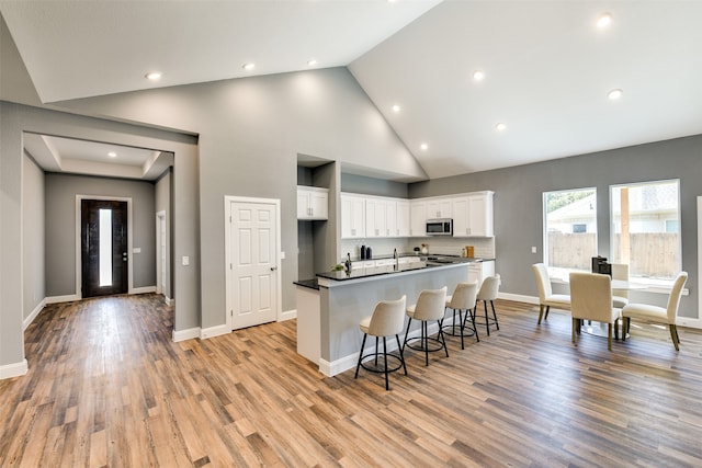 kitchen featuring white cabinets and light hardwood / wood-style flooring