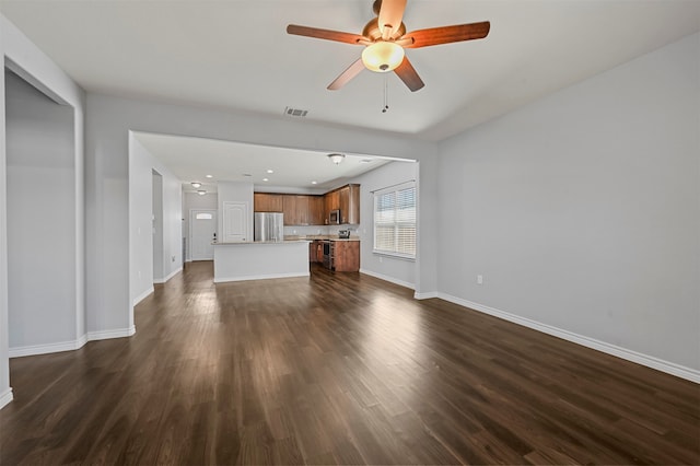 unfurnished living room with ceiling fan and dark hardwood / wood-style floors