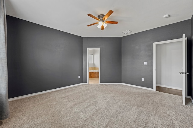 empty room with carpet and ceiling fan