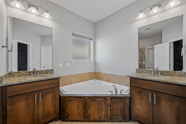 bathroom featuring vanity and separate shower and tub