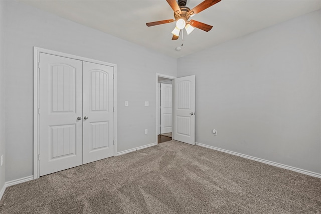 unfurnished bedroom featuring ceiling fan, a closet, and carpet