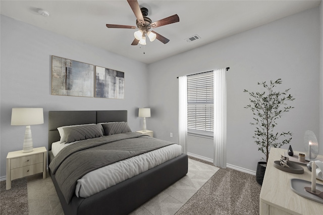 bedroom featuring light carpet and ceiling fan