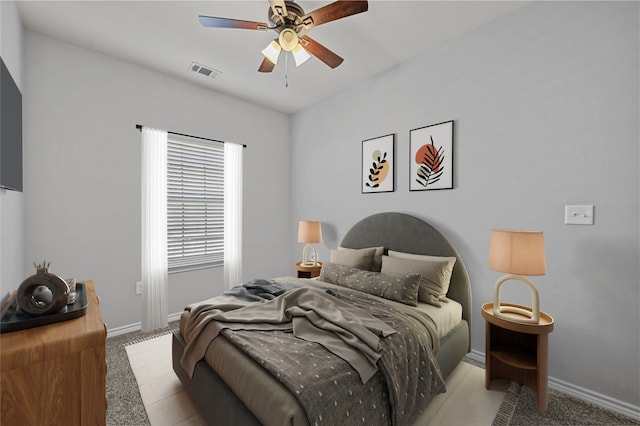 bedroom with light carpet and ceiling fan