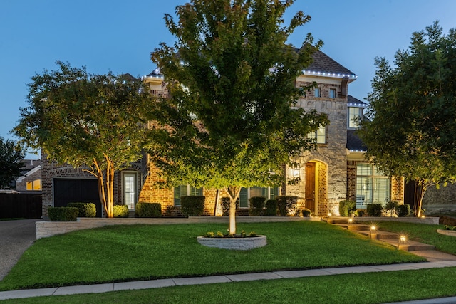 obstructed view of property featuring a lawn