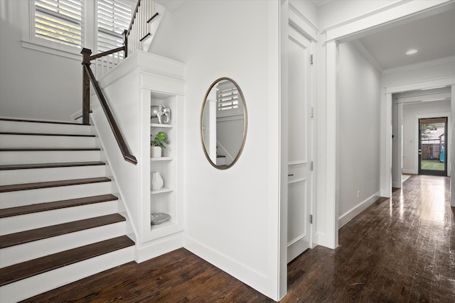 interior space with wood-type flooring and crown molding