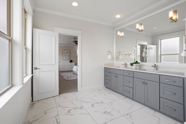 bathroom with ceiling fan, vanity, and ornamental molding