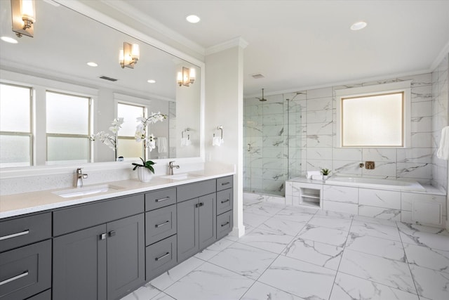 bathroom with ornamental molding, separate shower and tub, and vanity