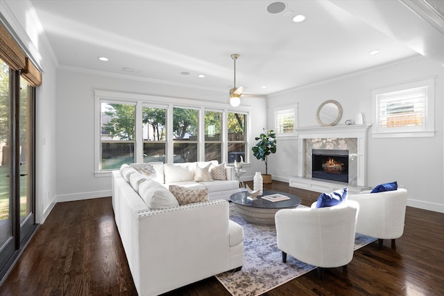 living room with ceiling fan, crown molding, dark hardwood / wood-style floors, and a high end fireplace